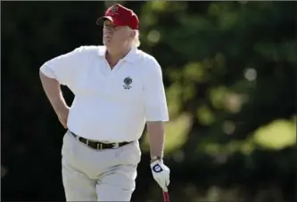  ?? PATRICK SEMANSKY, THE ASSOCIATED PRESS ?? Donald Trump stands on the 14th fairway during a pro-am round of the AT&T National golf tournament at Congressio­nal Country Club in Bethesda, Md. in 2012.