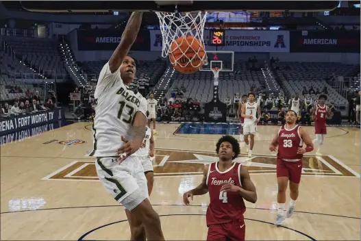  ?? JULIO CORTEZ — THE ASSOCIATED PRESS ?? UAB’s Christian Coleman (13) dunks as Temple’s Jordan Riley (4) and Sam Hofman (33) look on during the first half of the championsh­ip of the American Athletic Conference tournament on Sunday in Fort Worth, Texas.