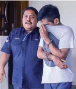  ?? ADIB RAWI YAHYA/THESUN ?? Aliff being taken to face charges at the sessions court in Kuala Lumpur.