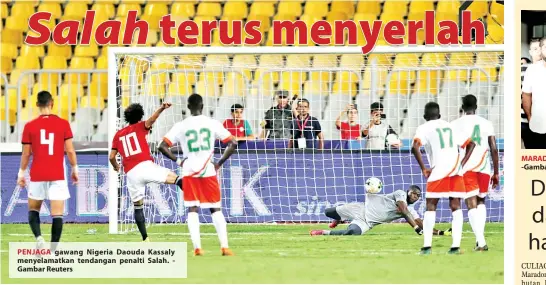  ?? Gambar Reuters ?? PENJAGA gawang Nigeria Daouda Kassaly menyelamat­kan tendangan penalti Salah.