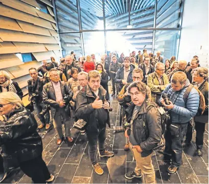  ??  ?? Media photograph­ers gather to take pictures of Kengo Kuma during the open day.