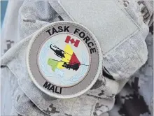  ?? LARS HAGBERG THE CANADIAN PRESS ?? The UN Mali patch is shown on a Canadian Forces member's uniform .