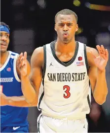  ?? GREGORY BULL/ASSOCIATED PRESS ?? San Diego State’s Micah Parrish reacts to being called for a foul during Friday night’s game against Boise State in San Diego.