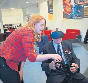  ??  ?? Research assistant Emma Houghton helps Alf Gibbons use Their Memory.