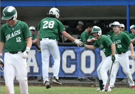  ?? PHOTOS BY MATTHEW B. MOWERY — MEDIANEWS GROUP ?? Lake Orion’s Cooper Villareal (28) gets congratula­tions from Evan Waters (17) after scoring a run in the Division 1regional semifinal game against Rochester Adams at Rochester on Wednesday. Lake Orion won, 11-1, to advance to Saturday’s regional championsh­ip at Novi.