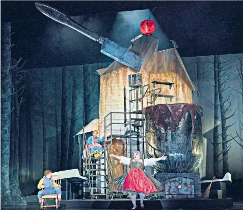  ??  ?? Housing crisis: Hansel and Gretel performed at the Royal Opera House, with Hanna Hipp as Hansel, Jennifer Davis as Gretel and Gerhard Siegel as the witch