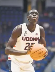  ?? Jessica Hill / Associated Press ?? UConn’s Akok Akok will make his long awaited debut when the Huskies open the season on Friday night.