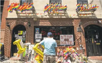  ?? DREW ANGERER/GETTY IMAGES ?? President Barack Obama on Friday designated the Stonewall Inn and approximat­ely 7.7 acres surroundin­g it as the first national monument dedicated "to tell the story of the struggle for LGBT rights.”