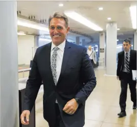  ?? J. Scott Applewhite ?? The Associated Press Sen. Jeff Flake, R-ariz., a member of the Foreign Relations Committee, arrives Wednesday for the start of a closed-door security briefing at the Capitol.