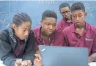  ?? PROVIDED BY MIKKI K. HARRIS ?? A group of students tries to solve an equation on a laptop during the SMASH (Summer Math and Science Honors) program at Morehouse College in Atlanta in 2017.