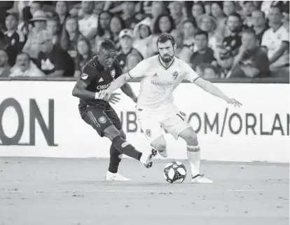  ?? KIM KLEMENT/USA TODAY SPORTS ?? Orlando City SC midfielder Jhegson Sebastian Mendez, left, was for his experience with the Ecuadorian national team.