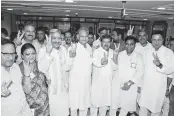  ?? PHOTO: PTI ?? Rajasthan Chief Minister Ashok Gehlot, along with Congress candidates, flashes the victory sign during the Rajya Sabha election in Jaipur on Friday