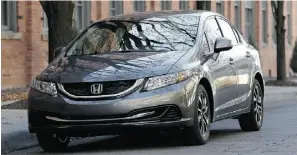  ?? PAUL SANCYA/ THE ASSOCIATED PRESS ?? The 2013 Honda Civic made its official debut at the LA Auto Show.