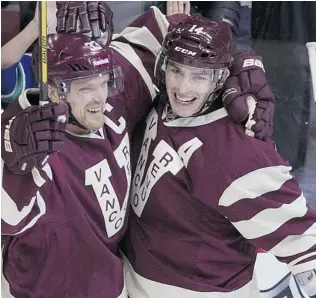  ?? GERRY KAHRMANN/ PNG ?? Canucks Henrik Sedin and Alex Burrows sport their Vancouver Millionair­es jerseys earlier this season, which would be ideal duds for next season’s outdoor game versus the Ottawa Senators.