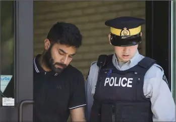  ?? CP PHOTO KAYLE NEIS ?? Truck driver Jaskirat Sidhu walks out of provincial court after appearing for charges due to the Humboldt Broncos bus crash in Melfort, Sask., on July 10, 2018. It’s been almost two years since the deadly Humboldt Broncos bus crash in Saskatchew­an and with the solemn anniversar­y comes a closing legal window that has seen several lawsuits filed in court.