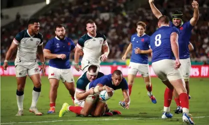  ??  ?? Gaël Fickou dives over to score France’s third try and ease their nerves after the USA had fought back to 12-9 in the Pool C game in Fukuoka. Photograph: Adam Pretty/Getty Images