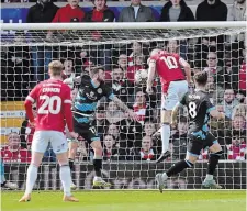  ?? JACOB KING THE ASSOCIATED PRESS FILE PHOTO ?? Wrexham’s Paul Mullin, second from right, scores their side’s second goal of the game during the Sky Bet League Two match on April 13. The club will be stopping in Vancouver as part of a three-city tour this summer.