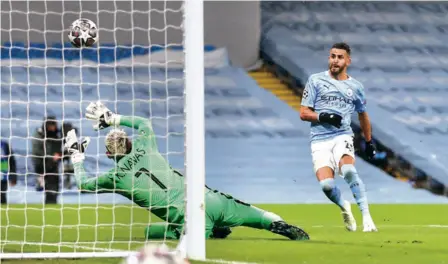 ?? AP ?? On target: Riyad Mahrez scores his second goal in Manchester City’s 2-0 second-leg win against Paris Saint-germain.