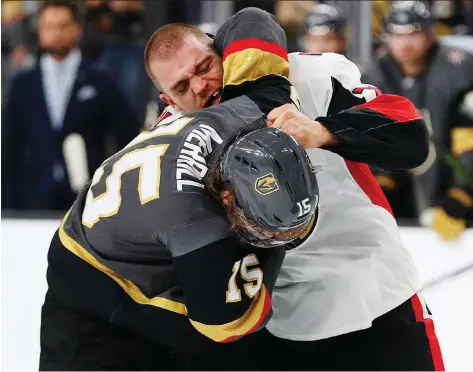  ?? JOHN LOCHER/THE ASSOCIATED PRESS ?? Senators defenceman Mark Borowiecki lands a right hand to the helmet of Golden Knights defenceman Jon Merrill in the first period Sunday in Las Vegas. Borowiecki was suspended for three games over a hit on the Knights’ Cody Eakins.