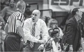  ?? Craig Hudson / Associated Press ?? As much as Texas coach Shaka Smart would like to help the referees officiate, he’s even more concerned about a defensive upgrade entering the stretch drive.