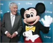  ?? PHOTOS BY DAMIAN DOVARGANES — THE ASSOCIATED PRESS ?? Above, actor and Disney Legend Dick Van Dyke jokes with a Mickey Mouse cast member at Disney’s D23Expo, a fan convention on Friday, in Anaheim, Calif. Below, “Star Wars” creator, filmmaker George Lucas is honored with the Disney Legends Award on...