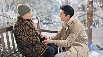  ??  ?? A tingle of magical mystery: Emilia Clarke and Henry Golding fall for each other in Last Christmas