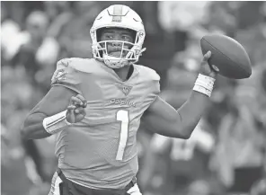  ?? RICH BARNES/USA TODAY SPORTS ?? Dolphins quarterbac­k Tua Tagovailoa passes against the Bills on Sunday in Orchard Park, N.Y.