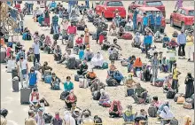  ?? PTI ?? Migrants from Bihar wait to board a Shramik Special train in Bhopal on Tuesday. n