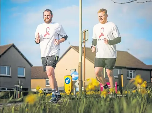  ??  ?? TRIBUTE: Callum and Sean clocked up 110 miles in memory of their gran Helen Hamilton, raising more than £2,000.