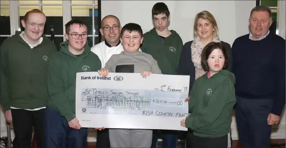  ??  ?? John Hutchinson and Kathryn Roche, Irish Country Meats; Lee Rogers, principal; and students Conor, Liam, Kaylum, Judith and Ben at the presentati­on of a cheque for €1,400 from Irish Country Meats to St Patrick’s Special School after its Christmas charity lunch.