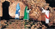  ??  ?? Women encounter a resurrecte­d Jesus at the tomb during the 2015 Prince of Peace Easter Pageant at the Holy City of the Wichitas near Lawton. [THE OKLAHOMAN ARCHIVES]