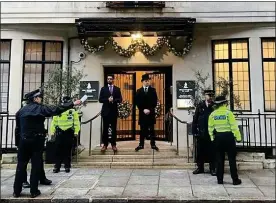  ??  ?? ROYAL PROTECTION: Police guard the entrance to the hospital on Friday