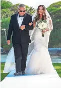  ??  ?? The beautiful bride walk up the aisle on the arms of her father Herbert Chong.