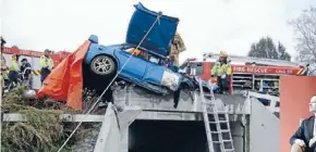  ?? Photos: Louie Douvis, Katie Bayes ?? PwC financial services partner and part-time rally driver Stuart Scoular, right, is back at work six months after he and his brother had a horrific accident during a race, above. He lost a leg, but both he and Bret were lucky to survive.