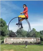  ?? CHELSEY LEWIS/MILWAUKEE JOURNAL SENTINEL ?? Big Bikin' Ben is a giant sculpture in Sparta, which bills itself as the Biking Capital of America.