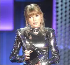  ?? — AFP file photo ?? Swift appeals for people to register to vote recently at the 2018 American Music Awards.