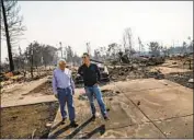  ?? Marcus Yam Los Angeles Times ?? GAVIN NEWSOM, right, then lieutenant governor, and Rep. Mike Thompson (D-St. Helena) survey the wildfire damage in Santa Rosa in October 2017.