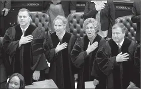  ?? Arkansas Democrat-Gazette/STATON BREIDENTHA­L ?? Arkansas Supreme Court Justices (left to right) Shawn A. Womack, Courtney Hudson Goodson, Josephine L. Hart and Robin F. Wynne recite the Pledge of Allegiance on Monday before Gov. Asa Hutchinson’s State of the State speech in the House chamber at the...