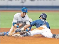  ?? STEVE NESIUS THE ASSOCIATED PRESS ?? Jays shortstop Richard Urena tags out Tampa Bay’s Mallex Smith after he got a little greedy trying to stretch a single to left.