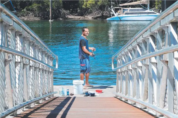  ?? Picture: JUSTIN BRIERTY ?? CALL TO DUTY: Heinz Szilagyi tries his fishing luck at the Tingira St boat ramp, Portsmith, which will be the kick-off point for the one-day Cairns Sportfishi­ng Competitio­n on September 25.