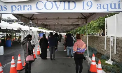  ?? Photograph: Robyn Beck/AFP/Getty Images ?? People wait in line for a Covid-19 test in Los Angeles, California, on 27 December 2021 as the Omicron variant continues to surge across the country.