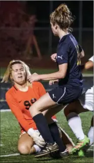  ?? JAMES BEAVER/FOR DIGITAL FIRST MEDIA ?? Lansdale Catholic goalie Abigail Shuster (99) narrowly avoids a big collision while making a save against St. Basil’s Sophia Mahoney (11) on Tuesday night.