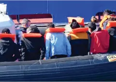  ??  ?? New arrivals: Migrants are brought into Dover yesterday