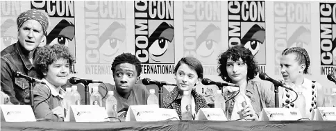  ??  ?? Cast members (from left) Matthew Modine, Gaten Matarazzo, Caleb McLaughlin, Noah Schnapp, Finn Wolfhard and Millie Bobby Brown at a panel for ‘Stranger Things’ during the 2017 Comic-Con Internatio­nal Convention in San Diego, California on Saturday. —...