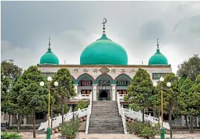  ??  ?? Once the centre of a thriving community, the Nanguan mosque has fewer people attending as a government crackdown on Muslims in the province of Ningxia takes hold.