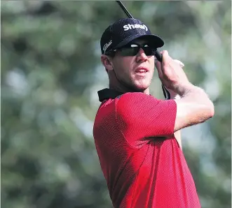  ?? RIDLEY/ GETTY IMAGES
VAUGHN ?? Graham DeLaet, of Weyburn, Sask., who was struggling with an injured thumb, plays his shot from the 14th tee during the first round of the RBC Canadian Open on Thursday at Glen Abbey Golf Club in Oakville, Ont.