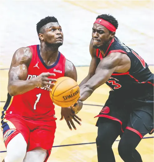  ?? Stephen Lew / USA TODAY Sports ?? New Orleans Pelicans forward Zion Williamson, left, is fouled by Toronto Raptors forward Pascal Siakam during
Saturday’s game at the Smoothie King Center. Siakam has fouled out of two games in a row for the Raptors.