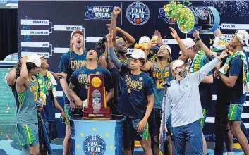  ?? DARRON CUMMINGS/ASSOCIATED PRESS ?? Baylor players and coaches celebrate after beating Gonzaga on Monday in Indianapol­is for the program’s first men’s basketball National Championsh­ip. The Bears beat the previously unbeated Bulldogs, 86-70.