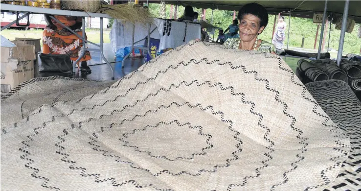  ?? Photo: Ronald Kumar ?? Alisi Tokalaudro­dro 54, with some of the mats she weaved on sale during the Lomaiviti Festival in Suva on December 6, 2017.