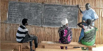  ??  ?? Lam Deng Luak is the principal of Future High School, in Juba’s protection of civilian site. He isn’t paid for his work, and the school survives on small, monthly donations from parents to buy chalk and textbooks.